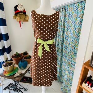 Retro inspired sleeveless brown/white polka dot with green satin bow (size 6)